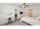 Bright bedroom with a queen bed, built-in shelves, and a ceiling fan at 3502 N 22 St, Phoenix, AZ 85016