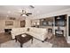 Open living space with L-shaped sofa, wood floors and a view to kitchen at 3502 N 22 St, Phoenix, AZ 85016