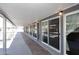 Covered walkway alongside the pool with sliding glass doors at 3502 N 22 St, Phoenix, AZ 85016