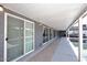 Covered walkway alongside the pool with sliding glass doors at 3502 N 22 St, Phoenix, AZ 85016