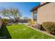 Green backyard with artificial turf and a view of the pool at 3729 E Donald Dr, Phoenix, AZ 85050