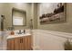 Modern powder room with a light wood vanity and green walls at 3729 E Donald Dr, Phoenix, AZ 85050