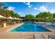 Resort-style pool with multiple umbrellas and lounge chairs at 3729 E Donald Dr, Phoenix, AZ 85050