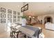 Open dining area with a farmhouse table and kitchen views at 3729 E Donald Dr, Phoenix, AZ 85050