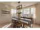 Bright dining room featuring a wood table and chandelier at 3729 E Donald Dr, Phoenix, AZ 85050