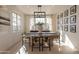 Elegant dining room with a farmhouse table and large windows at 3729 E Donald Dr, Phoenix, AZ 85050