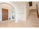 Light and airy entryway with hardwood floors and staircase at 3729 E Donald Dr, Phoenix, AZ 85050