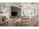 Bright living room with vaulted ceilings, sectional sofa, and a wood accent wall at 3729 E Donald Dr, Phoenix, AZ 85050