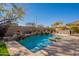 Inviting pool with water features and a built-in BBQ at 3729 E Donald Dr, Phoenix, AZ 85050