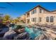 Stunning pool and spa with outdoor seating area at 3729 E Donald Dr, Phoenix, AZ 85050