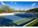 Two lighted tennis courts with nets and surrounding fencing at 3729 E Donald Dr, Phoenix, AZ 85050