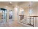 Bright upstairs hallway with chandelier and access to bedrooms at 3729 E Donald Dr, Phoenix, AZ 85050