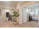 Elegant upstairs hallway with a view into a bedroom and a staircase at 3729 E Donald Dr, Phoenix, AZ 85050