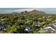 Aerial view of a residential neighborhood with Camelback Mountain in the background at 3837 E Heatherbrae Dr, Phoenix, AZ 85018