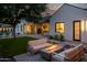 Evening view of a relaxing backyard with fire pit at 3837 E Heatherbrae Dr, Phoenix, AZ 85018