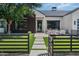 Landscaped front yard with a modern black fence and walkway leading to the home's entrance at 3837 E Heatherbrae Dr, Phoenix, AZ 85018