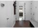 Bright hallway with modern doors and wood flooring at 3837 E Heatherbrae Dr, Phoenix, AZ 85018