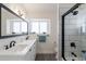 Updated bathroom features double vanity, subway tile shower, and modern fixtures at 3930 W Saragosa W St, Chandler, AZ 85226