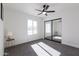 Bedroom with mirrored closet doors, ceiling fan and window at 3930 W Saragosa W St, Chandler, AZ 85226