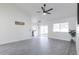 Bright and airy living area with gray vinyl flooring and ceiling fan at 3930 W Saragosa W St, Chandler, AZ 85226