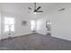 Spacious primary bedroom with gray carpet and ceiling fan at 3930 W Saragosa W St, Chandler, AZ 85226