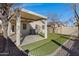 Covered patio, artificial turf, and a spacious backyard at 415 E Glenhaven Dr, Phoenix, AZ 85048