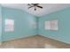 Empty bedroom with light teal walls and wood flooring at 415 E Glenhaven Dr, Phoenix, AZ 85048