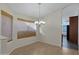 Dining room features hardwood floors and a chandelier at 415 E Glenhaven Dr, Phoenix, AZ 85048