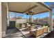 Covered patio with seating area, perfect for relaxing at 415 E Glenhaven Dr, Phoenix, AZ 85048