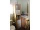 Bathroom with sink, toilet and shelving unit at 4220 E Main St # F-45, Mesa, AZ 85205