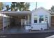 Front view of manufactured home with carport and storage at 4220 E Main St # F-45, Mesa, AZ 85205