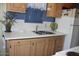 Simple kitchen with double sink and wood cabinets at 4220 E Main St # F-45, Mesa, AZ 85205