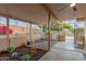 Relaxing backyard patio with seating area, wrought iron fencing, and landscaping at 4301 W Dahlia Dr, Glendale, AZ 85304