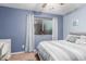 Bedroom with a double bed, a desk, and light blue walls at 4301 W Dahlia Dr, Glendale, AZ 85304