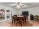 Dining area with a wood table, four chairs, and access to a patio at 4301 W Dahlia Dr, Glendale, AZ 85304