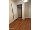 Bright bedroom with wood-look flooring and a spacious closet at 469 W Newmont St, Superior, AZ 85173