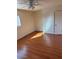 Bright bedroom with wood-look floors and ample closet space at 469 W Newmont St, Superior, AZ 85173