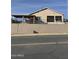 House exterior featuring a covered patio and a fenced yard at 469 W Newmont St, Superior, AZ 85173