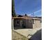 Tan house with covered patio, mountain views, and AC unit at 469 W Newmont St, Superior, AZ 85173