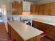 Kitchen with wood cabinets and a breakfast bar at 469 W Newmont St, Superior, AZ 85173