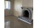 Living room featuring a fireplace and tile floors at 469 W Newmont St, Superior, AZ 85173