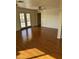 Bright living room featuring hardwood floors and French doors at 469 W Newmont St, Superior, AZ 85173