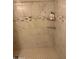 Clean shower with marble tile and corner shelves at 469 W Newmont St, Superior, AZ 85173