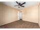 Bright bedroom with ceiling fan and carpet at 4723 W Gelding Dr, Glendale, AZ 85306