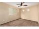 Well-lit bedroom featuring a ceiling fan at 4723 W Gelding Dr, Glendale, AZ 85306