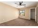 Spacious bedroom with large window and ceiling fan at 4723 W Gelding Dr, Glendale, AZ 85306