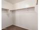 Walk-in closet with double hanging rods at 4723 W Gelding Dr, Glendale, AZ 85306