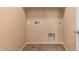 Laundry room with built-in shelving at 4723 W Gelding Dr, Glendale, AZ 85306