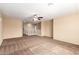 Carpeted living room with ceiling fan at 4723 W Gelding Dr, Glendale, AZ 85306