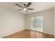 Bedroom with wood floors, white brick wall, and ceiling fan at 4800 N 68Th St # 264, Scottsdale, AZ 85251